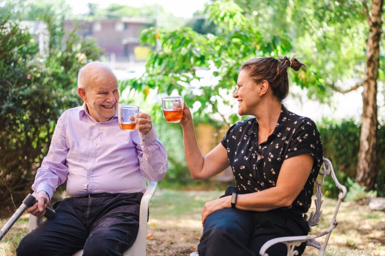 Woman caring for an older man